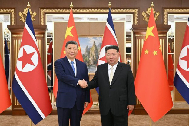 Xi Jinping and Kim Jong-Un shake hands in the newly renovated Kumsusan State Guesthouse following their first round of talks in Pyongyang in June 2026